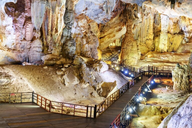 Intricate limestone formations reveal the remarkable geological beauty of Paradise Cave, formed over millions of years.